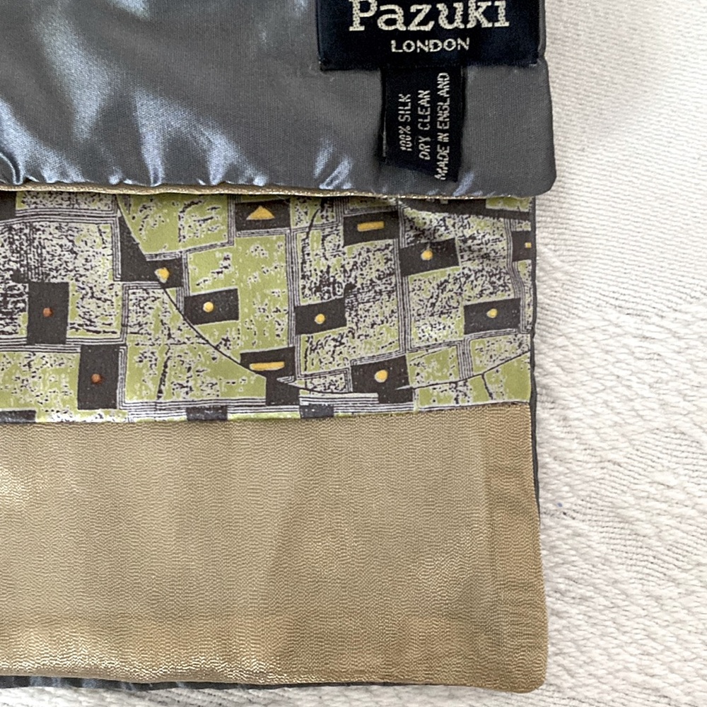 8" width. 54" length. Multi green/shades of gray print front. Back gray